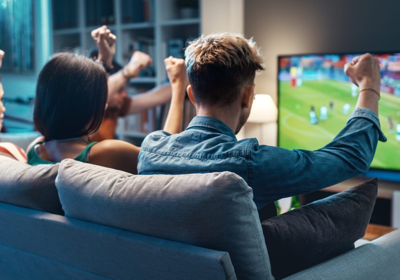 Group,Of,Young,Friends,Watching,A,Football,Match,On,Tv
